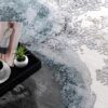 Modern rug with magazine and coffee on black tray.