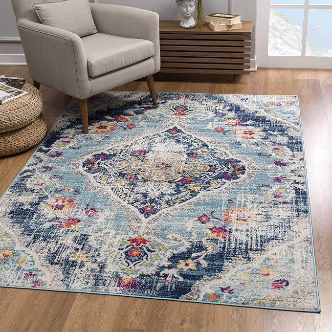 Elegant blue floral area rug in cozy living room.