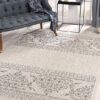 Living room with elegant patterned area rug.