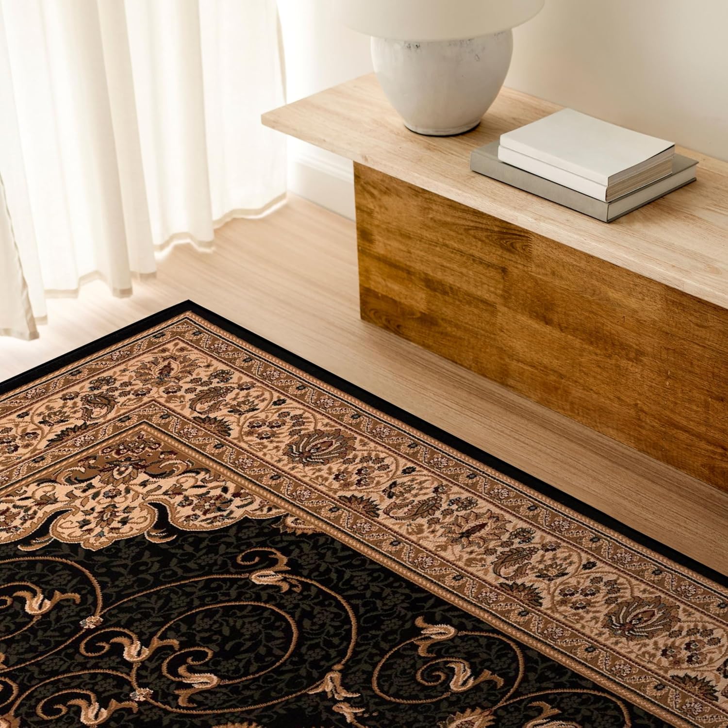 Elegant living room with ornate rug and wooden bench.