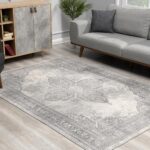 Gray rug in modern living room setting.