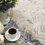 Textured rug with coffee cup and flowers