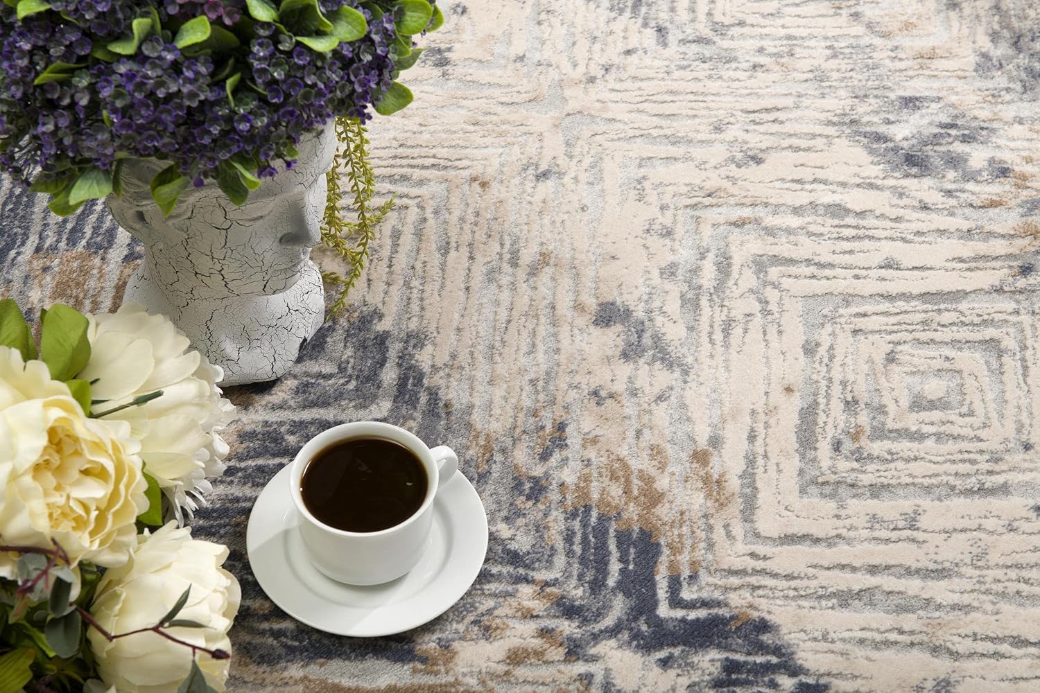 Textured rug with coffee cup and flowers