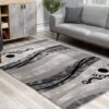Modern living room with abstract rug design.