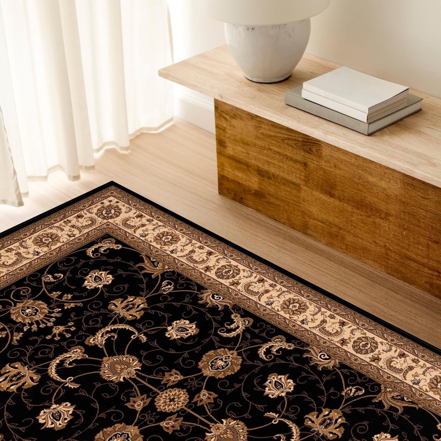 Elegant floral carpet on wooden floor.