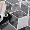 Modern geometric carpet with coffee and magazine