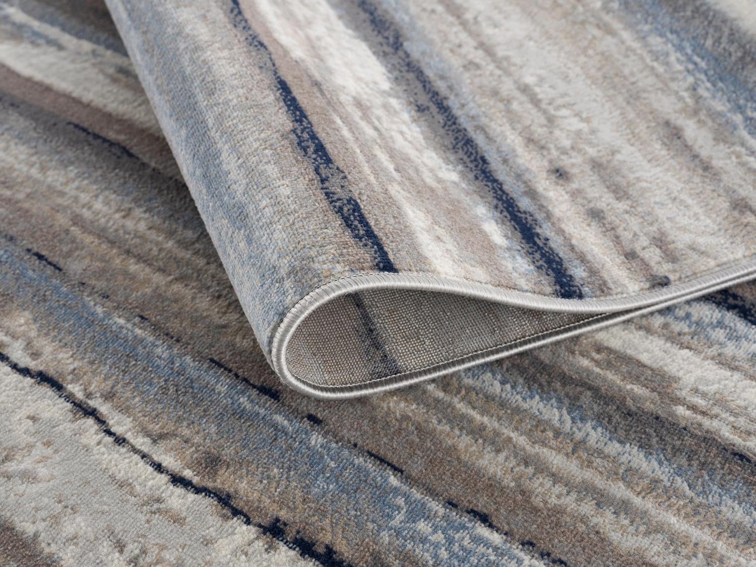 Textured blue and beige patterned floor rug