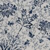 Blue floral pattern on textured fabric background.