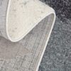 Textured rug with gray and beige patterns