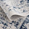 Blue and white patterned rug, close-up view