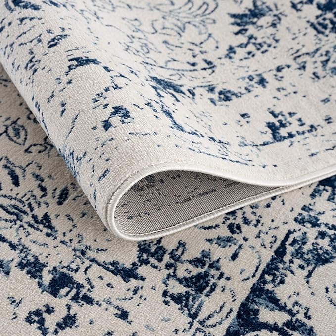 Blue and white patterned rug, close-up view