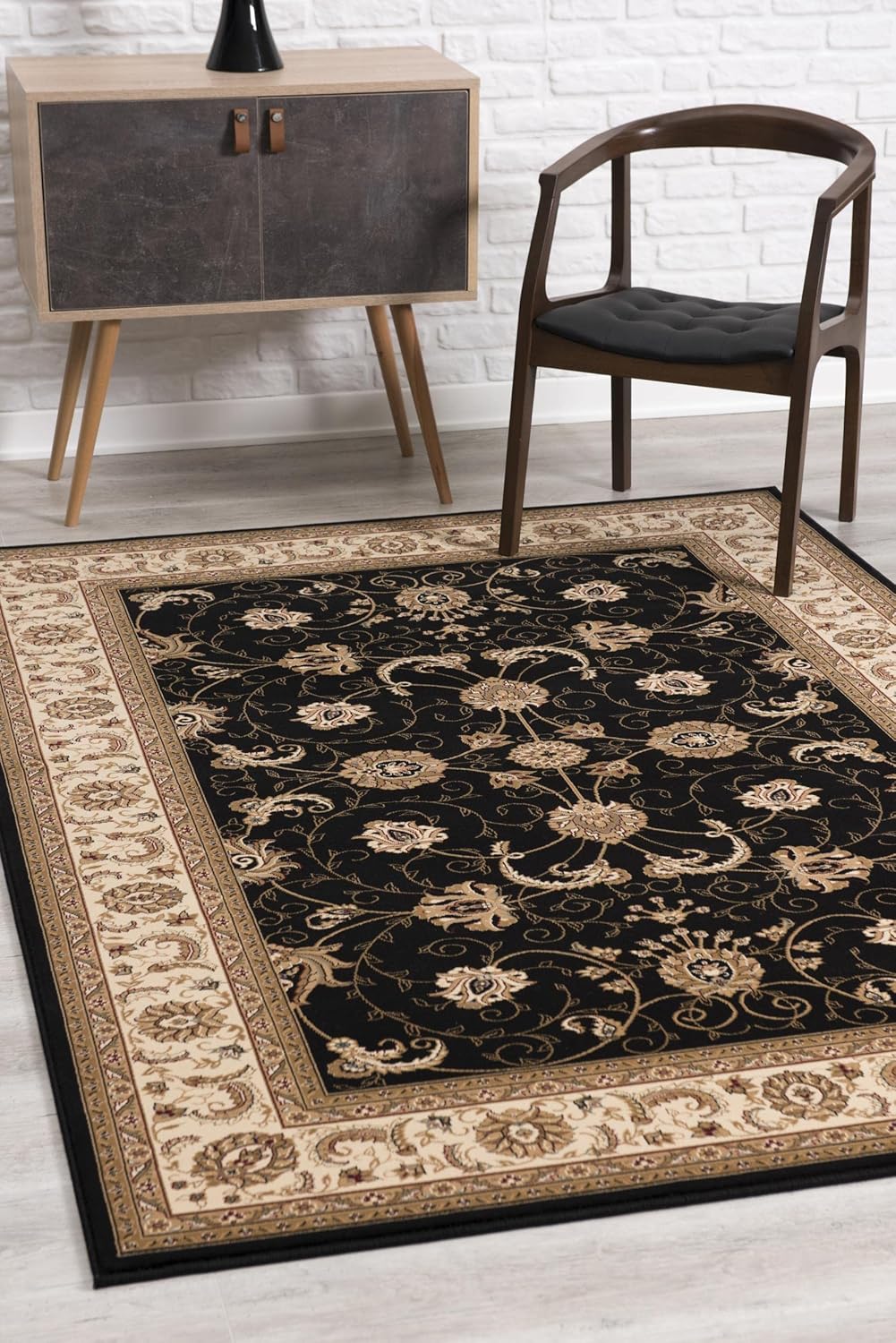 Elegant black and beige floral area rug.