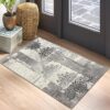 Patterned gray rug beside a door