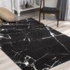 Modern black rug with white abstract pattern.