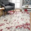 Modern living room with abstract red-gray rug