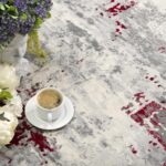 Coffee on floral-patterned carpet with flowers