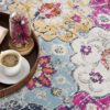 Colorful rug with coffee and open book