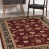 Elegant red and gold patterned rug in room
