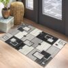 Modern geometric rug with black and grey patterns