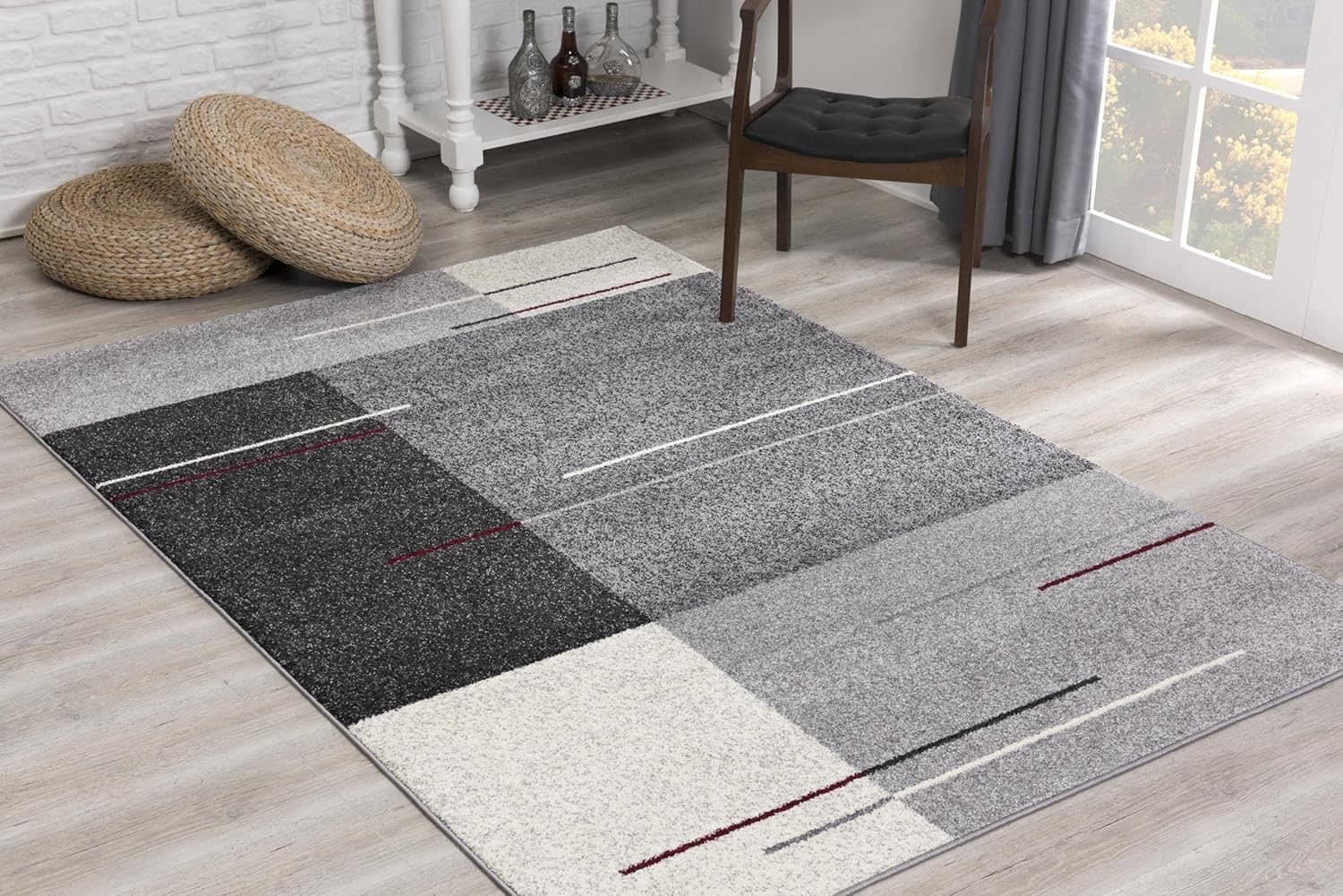 Gray geometric living room rug on wooden floor