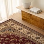 Elegant floral rug under a wooden bench