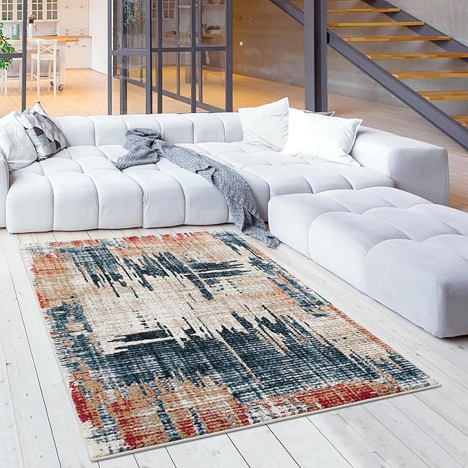 Modern living room with abstract rug and white sofa.