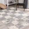 Gray and white checkered rug in modern room