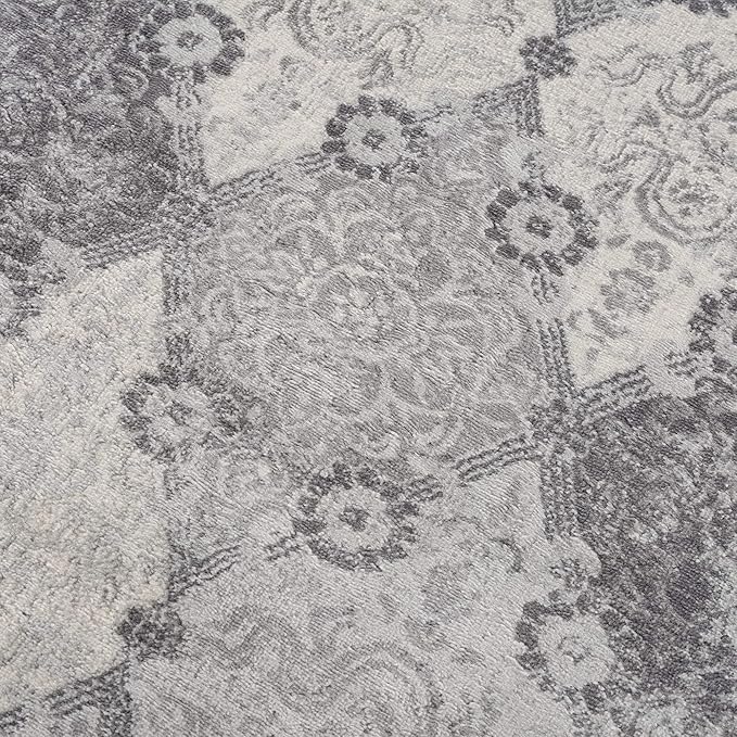 Gray floral patterned rug texture closeup