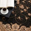 Ornate rug with coffee and book on tray.