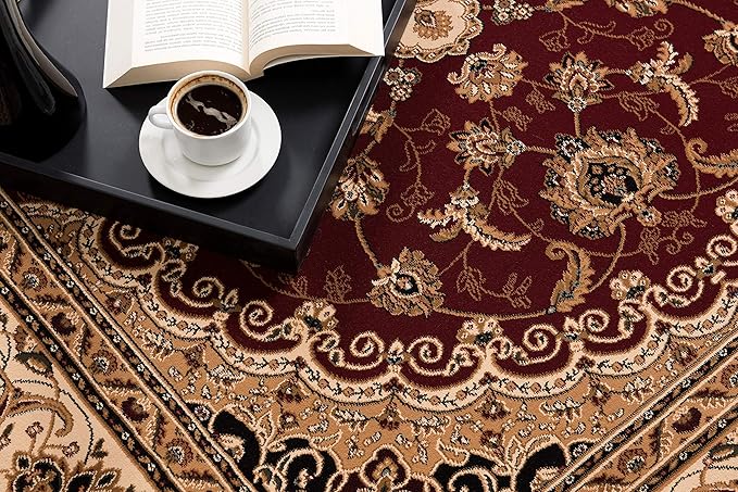 Ornate rug with coffee and open book nearby.