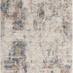 Abstract patterned beige and gray area rug.