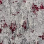Abstract gray and red textured area rug.