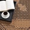 Book and coffee on decorative carpet