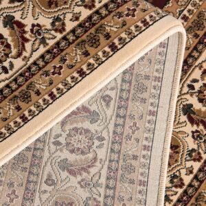 Intricate floral pattern on beige and brown rug.