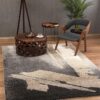 Modern living room with abstract rug and chair