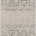 Beige rug with intricate floral patterns.
