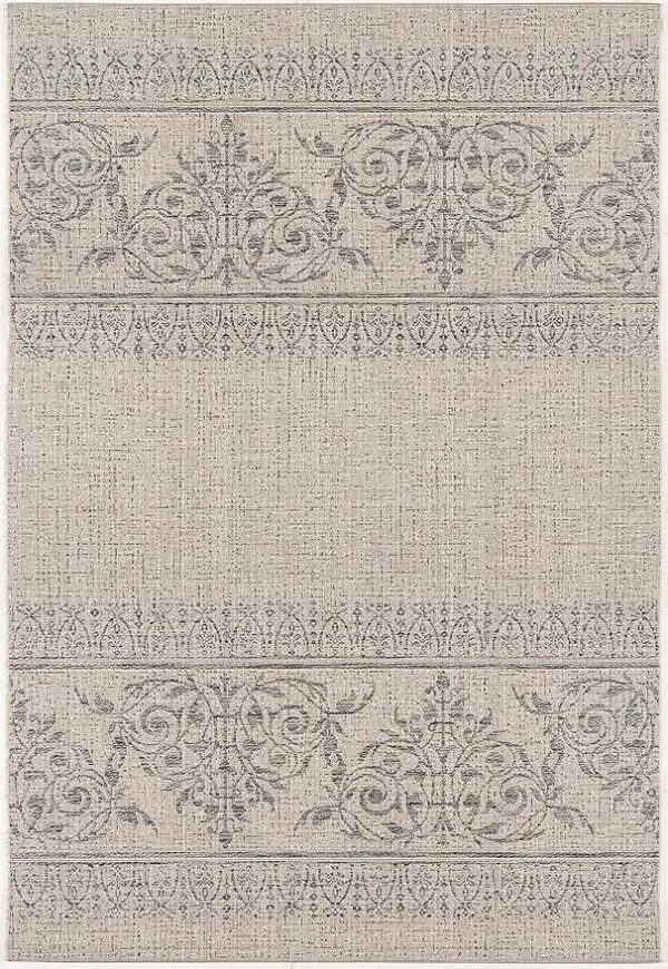 Beige rug with intricate floral patterns.
