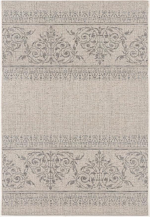 Beige rug with intricate floral patterns.