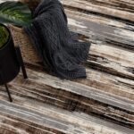 Textured rug with basket and plant decoration