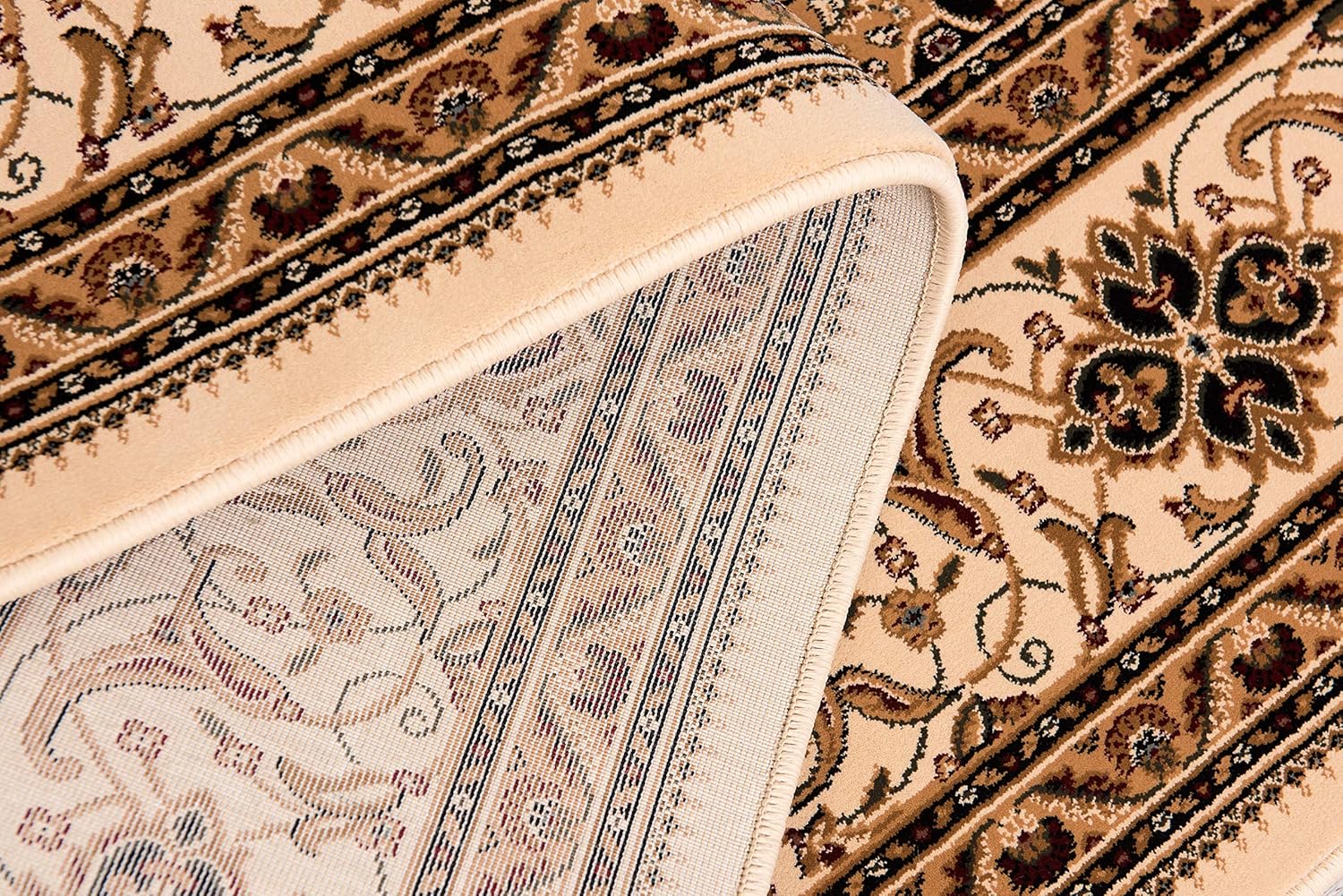 Detailed close-up of ornate beige carpet pattern.