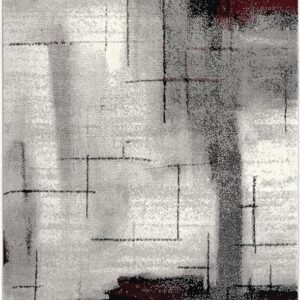 Abstract rug with geometric patterns in gray and red.