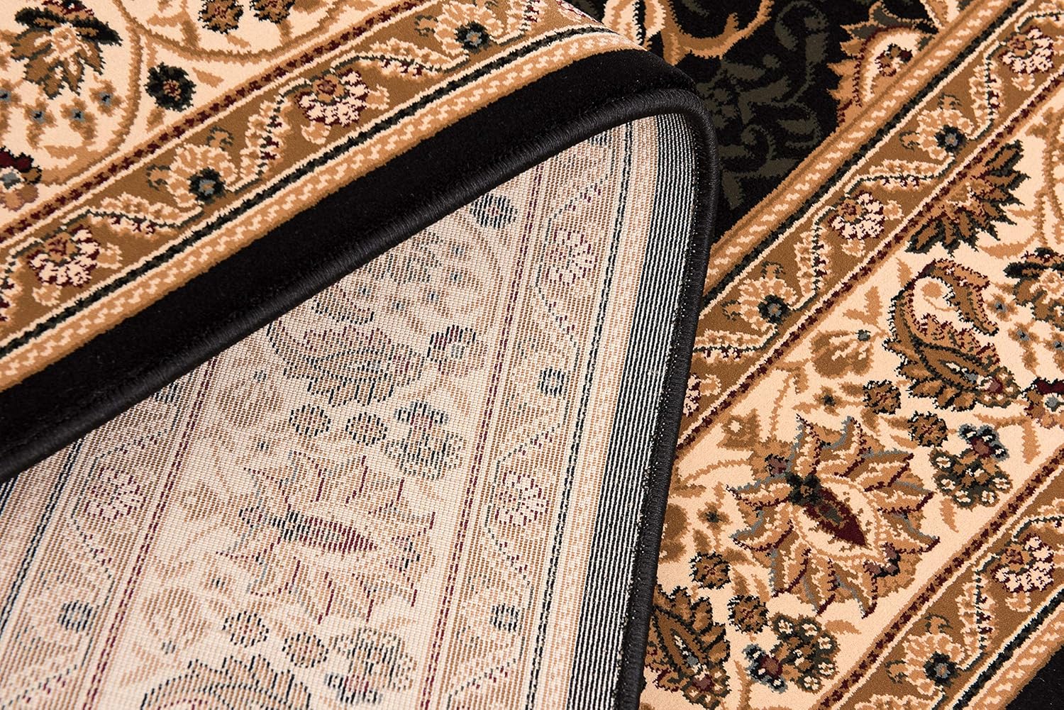 Intricate floral-patterned carpet corner close-up.