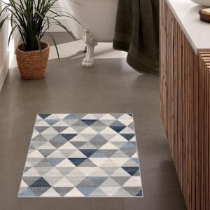 Geometric-pattern bathroom rug on gray floor