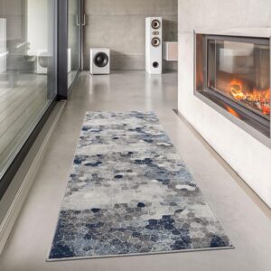 Modern living room with blue-gray geometric rug.