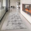 Gray runner rug in modern living room with fireplace.
