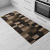 Geometric kitchen rug on white tile floor.