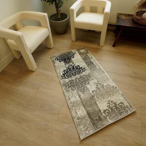 Patterned rug between two chairs on wooden floor.