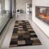 Modern hallway with geometric rug and fireplace