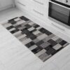 Geometric kitchen rug on tiled floor.