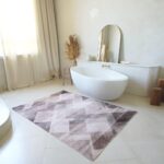 Modern bathroom with large geometric-patterned rug